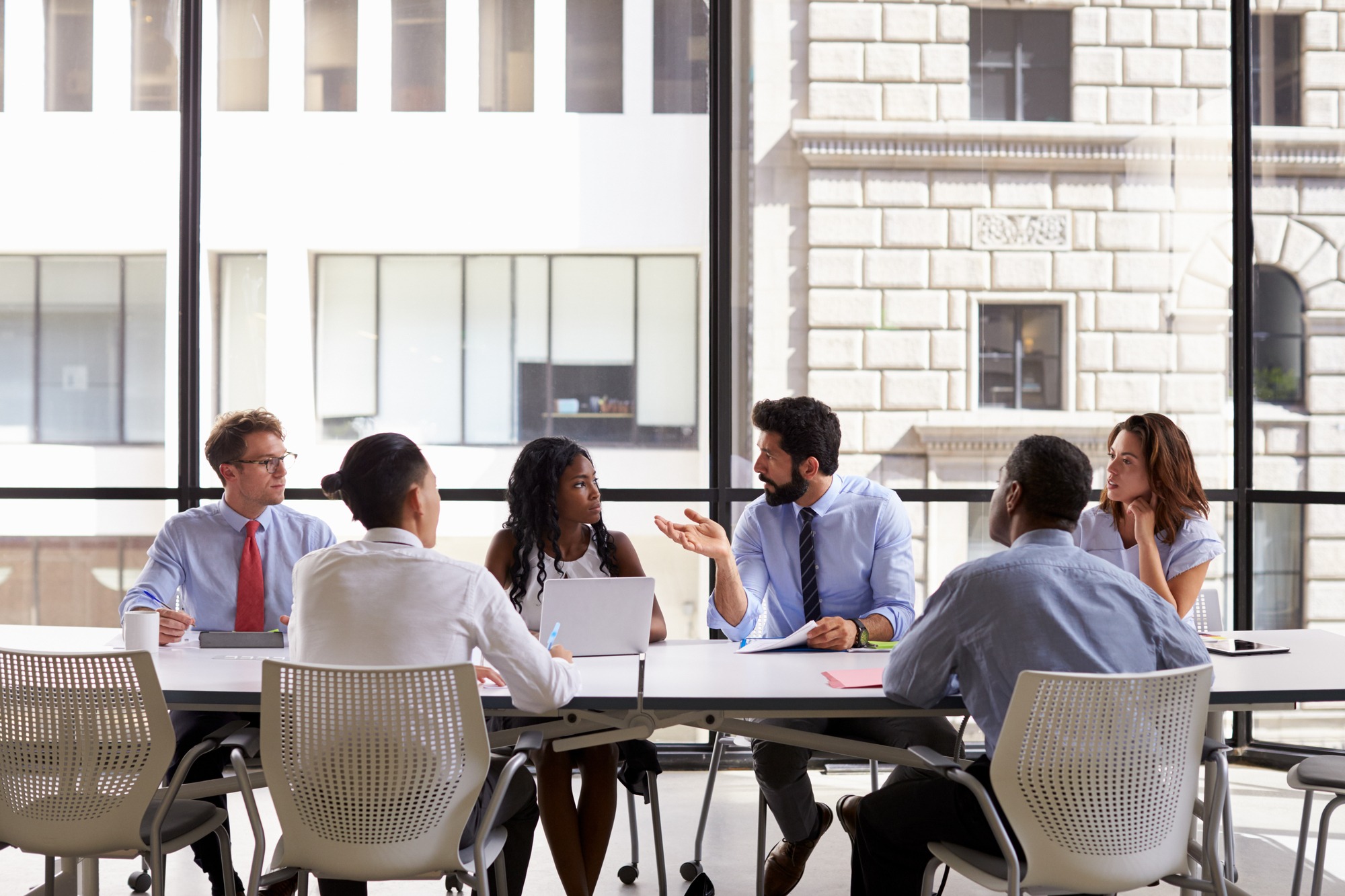 Corporate business team meeting in a modern open plan office